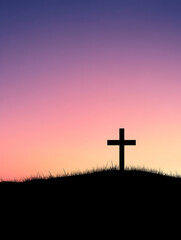 Silhouette of a cross against a vibrant sunset
