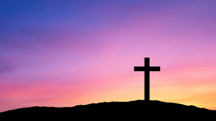 Silhouette of a cross atop a hill against a vibrant sunset (2)