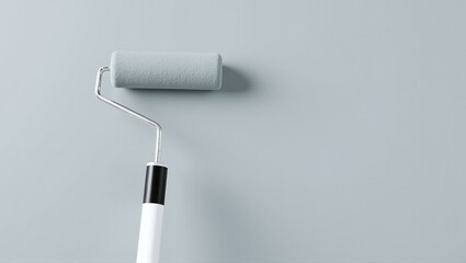 Obraz premium Close-up of paint roller applying fresh color to gray surface, showcasing home improvement and renovation process in action.