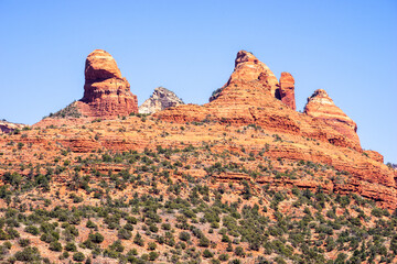 Red sandstone formations and blue sky background near Sedona, Arizona