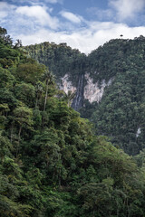 tropical mountains in the middle of the jungle with a blue sky. Colombian landscape of canyons and the Andean mountain range with vivid colors and adventure.