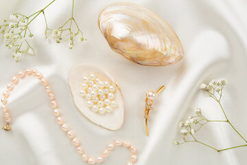 Elegant golden jewelry with decoration on textile background, top view