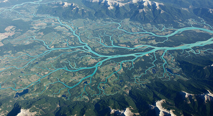 Stunning Aerial View of Intricate River Networks and Mountain Ranges