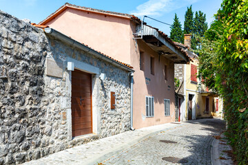  Charming cobblestone street with historic buildings in Podgorica, Montenegro, under clear blue skies