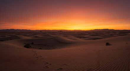 Ethereal desert sunset with gradient hues merging terracotta and sand dunes