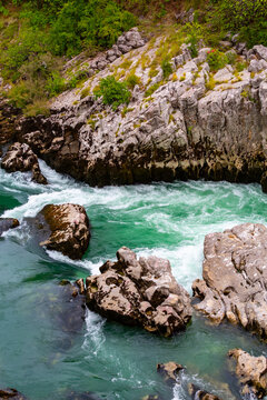  Scenic view of Moraca river rapids flowing through rocky terrain in Podgorica, Montenegro