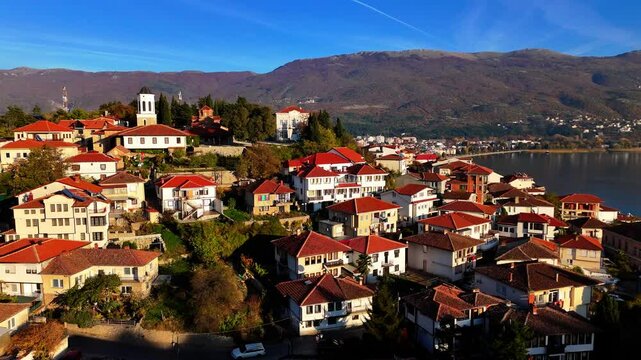 Close up drone shot of Varo&scaron;, the Old Town of Ohrid, Macedonia in Golden hour showing Church of the Virgin Mary Peribleptos