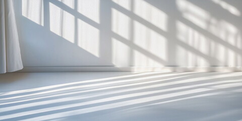 Obraz premium Soft shadows created by sunlight on a minimalist white floor 