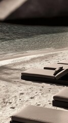 Serene beachfront loungers overlooking calm ocean waters