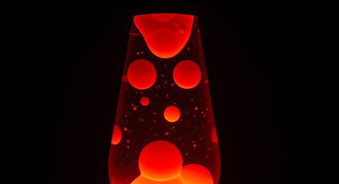 Captivating red lava lamp with floating blobs in a darkened ambiance creates a retro vibe