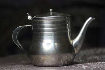 A close-up of a moroccan metal teapot