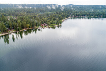 A lake with a forest in the background