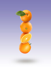 Fresh juicy oranges and green leaf falling on color gradient background