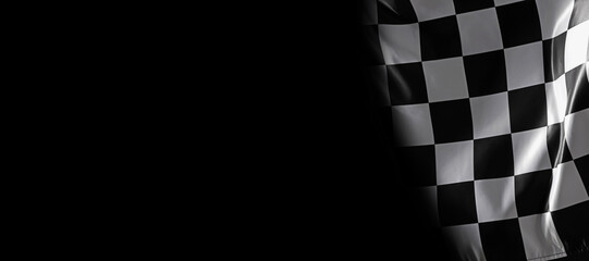 Racing flag with black and white checkers in darkness, space for text. Banner