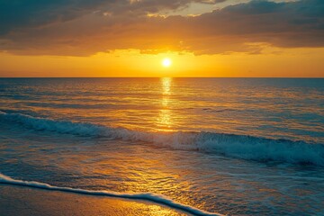 Golden sunset over the ocean  captivating reflections and vibrant hues at the water s edge