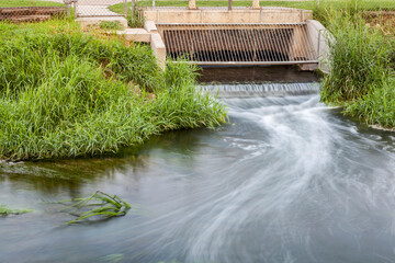 Processed and cleaned sewage flowing out from water reclamation facility to a river