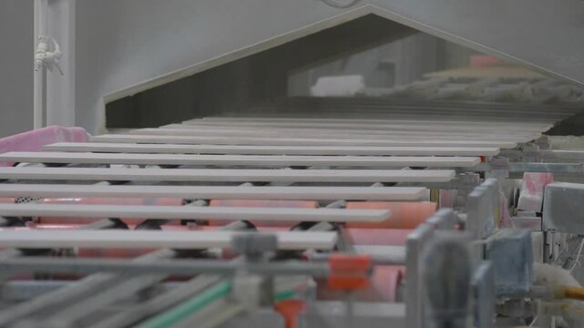 Production factory line of ceramic tiles. Conveyor belt system. Modern heavy plant. Ceramic tile manufacturing