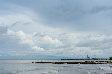 Seascape of a coastline with a dock at a port for coal transport ships in the Colombian Caribbean.