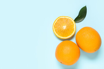 Composition with tasty oranges on blue background