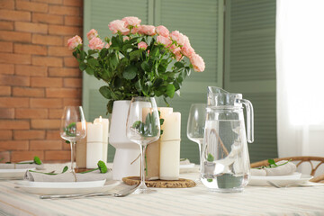 Beautiful table setting with floral decor in dining room