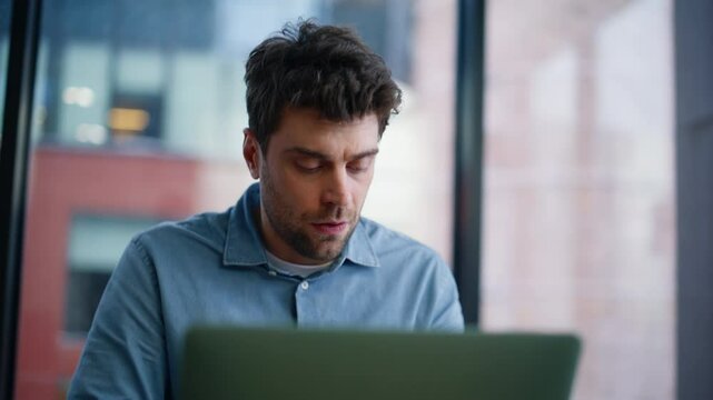 Freelancer worried phone call sitting home workplace closeup. Confused man 