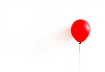 A single vibrant red balloon floats against a pure white backdrop, rubber, graphic