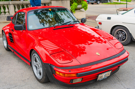 Chicago, Illinois - September 29, 2024: Porsche 930 turbo or 911 red color. Porsche 930 turbo or 911 parked on the street. front view. Porsche 930 turbo or 911 in Chicago