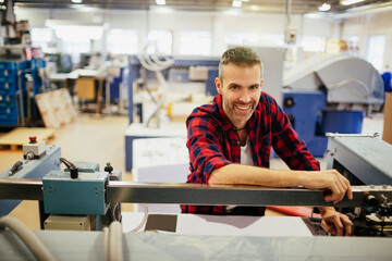 Portrait of a young male printing press office worker