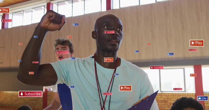 In school, coach instructing team using animation with digital play icons overlaying