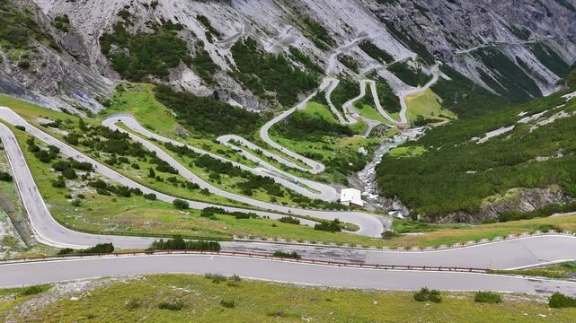 Drone shot flying down the lower section of the Bormio Stelvio Pass, Italy