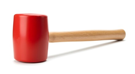 Close-up of a red rubber mallet with a wooden handle used for light hammering on a white surface.