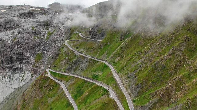 Drone shot flying through the clouds over Prato allo Stelvio Pass, Italy