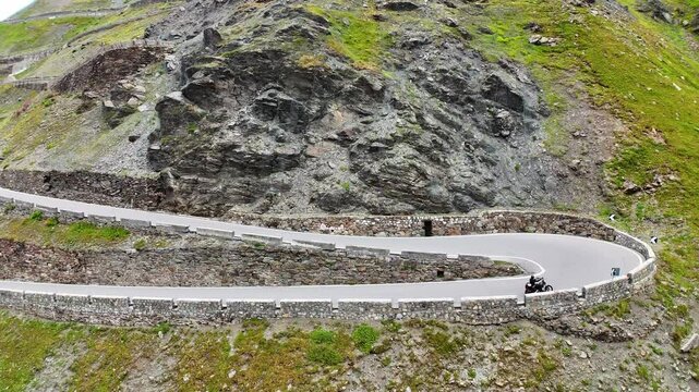 Motorcycle driving over the Prato allo Stelvio Pass, Italy