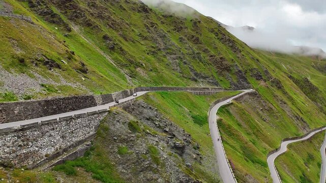 Motorcycle driving over the hairpin road of the Prato allo Stelvio Pass, Italy