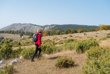 Fototapeta premium A male hiker trail hiking mountain forest, active lifestyle.