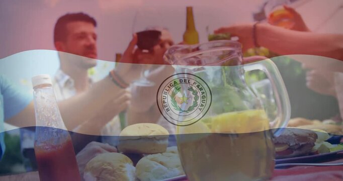 Overlaying Paraguay flag, people having outdoor meal with drinks and food