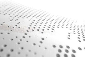 White perforated surface background with holes, abstract design, and minimalist perspective