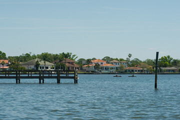 Wide scenic view of Coffee Pot Park in St. Petersburg, Florida. green tree branch left  with bay,...