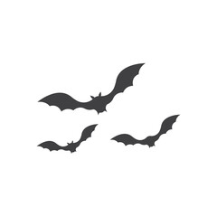 Three silhouettes of bats flying