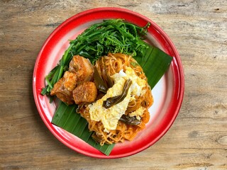 Pad Thai in Chanthaburi Province,Thailand. Pad Thai is popular on street food, stired noodles with shrimps, egg served with lime,vegetable. 