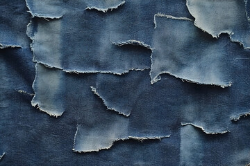 Creative blue denim fabric background with textured patchwork and frayed edges design