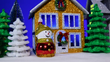 Beautiful grey and brown blue christmas houses with snowmen in the foreground
