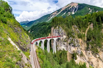 Poster A Rhaetian Railway train crossing the Landwasser Viaduct at Grisons in Switzerland