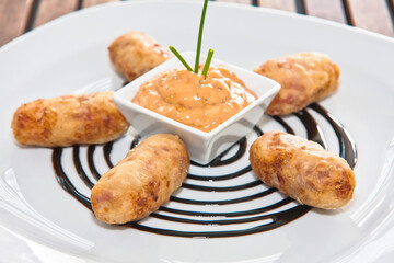 Crispy croquettes, traditional croquettes accompanied with dressing