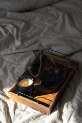 Incandescent Candle and Incense Burning Creating Cozy Mood. Home Decor Idea for Calm Autumn Day.