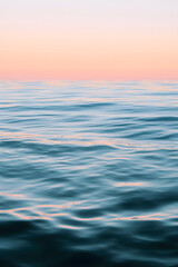 Fototapeta premium Serenity in Soft Hues: Gentle Ocean Waves Reflecting Tranquility and Calm