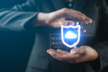 Businessman touching a virtual screen displaying cybersecurity protection, emphasizing online privacy threats, secure data access, identity theft prevention, and advanced cyber defense strategies.