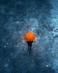 Woman walking alone with orange umbrella, snowy street, night