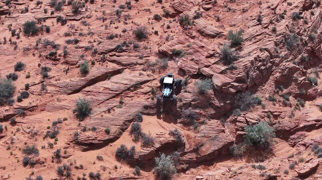 Aerial Sand Hollow Utah rock crawler desert. Southern desert Sand Hollow. Red sandstone, dirt, sand trails, rocky cliffs and ledges. Nature erosion into canyons. Outdoor extreme 4x4 recreation.