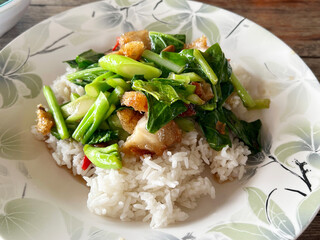 stir fry pork with fried rice and green kale